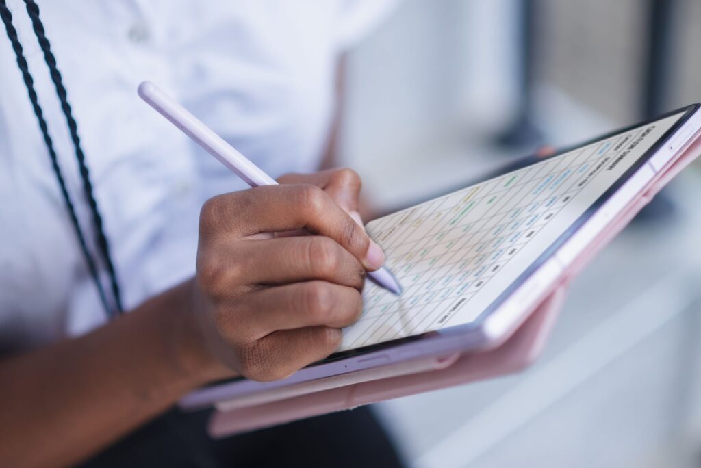 A participant tracking their NDIS core support budget on a digital tablet.
