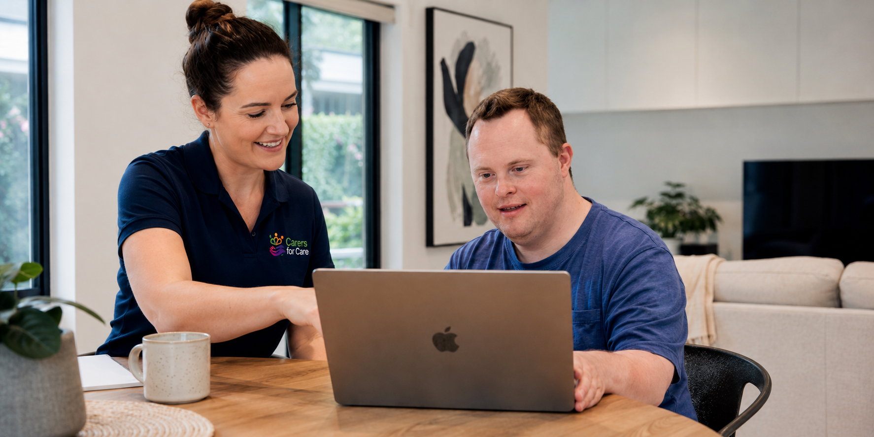 A friendly professional ndis support worker helping an Australian participant review their plan options on a laptop.